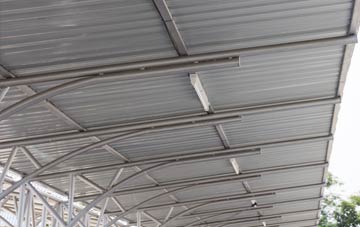 installing Hinton In The Hedges metal roofing